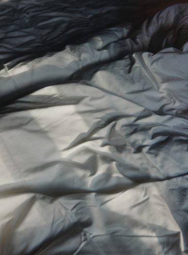 White sheets and bed linen at Backstage Hotel